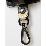 Close-up of Dolce & Gabbana Multicolor Camouflage Leather Metal Accessory Airpods Case showing metal clasp and logo detail.