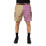 Dolce & Gabbana Multicolor Playing Card Camouflage Shorts Swimwear, featuring magenta and mustard card motif with camouflage details.