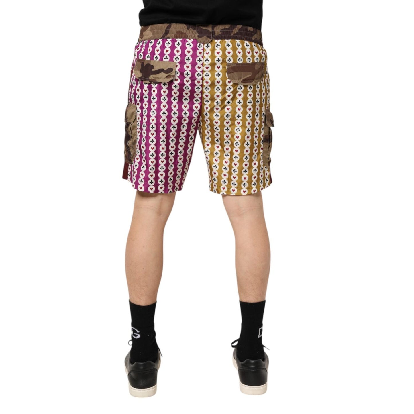 Back view of Dolce & Gabbana Multicolor Playing Card Camouflage Shorts Swimwear showcasing magenta and mustard hues.