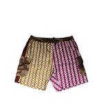 Dolce & Gabbana Multicolor Playing Card Camouflage Shorts Swimwear with bold magenta, mustard, and camouflage design.
