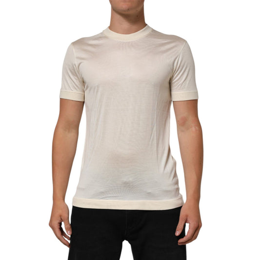 Dolce & Gabbana Off White Silk Crew Neck Short Sleeve T-shirt modeled by man, showcasing luxury fabric and classic fit design.