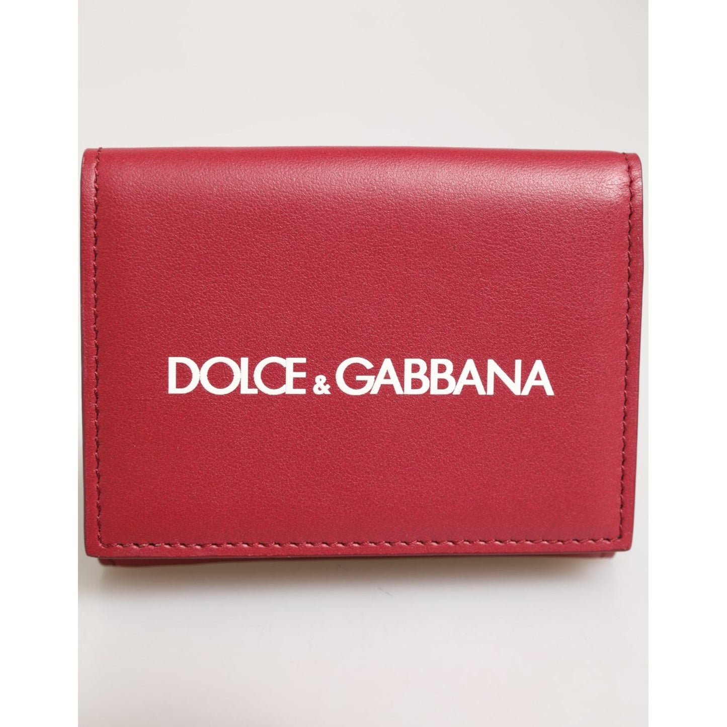 Dolce & Gabbana Red Leather Bold Logo Print Trifold Card Holder Wallet in vivid red with white logo, crafted in Italy.