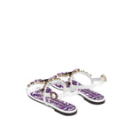 Dolce & Gabbana Sandals Purple with white rhinestone embellishments, side buckle fastening, and flat sole Maiolica leather design.