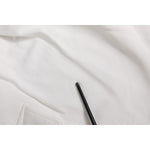 Close-up of Dolce & Gabbana White Cotton Cargo Bermuda Sweatshorts fabric and texture detail, highlighting drawstring and pocket.