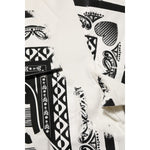 Close-up of Dolce & Gabbana White Cotton Logo Bandana Print Men T-shirt with black and white pattern, highlighting minor defects.