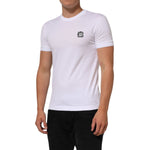Dolce & Gabbana White Cotton Logo Patch Crew Neck T-shirt worn by model, showcasing soft cotton material and distinct logo patch.