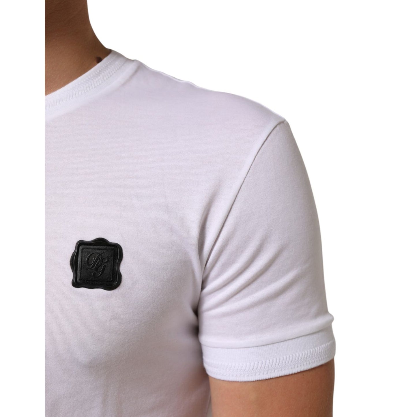 Close-up of Dolce & Gabbana White Cotton Logo Patch Crew Neck T-shirt showing black logo patch on short sleeve.