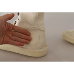 Dolce & Gabbana White Leather Lace Up Mens Boots with minor defect and hand showing minor marks on ankle area.