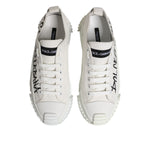 Dolce & Gabbana White Logo Graffiti Low Top Sneakers Shoes featuring black graffiti-style logo on white canvas with rubber sole.