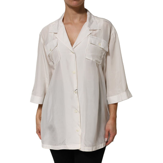 Dolce & Gabbana White Silk Collared 3/4 Sleeves Blouse Top with button closure and dual flap pockets, model in elegant white shirt.