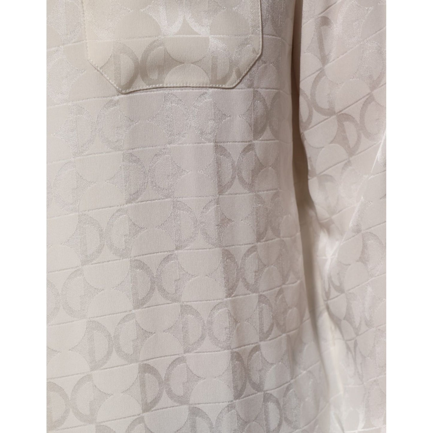 Close-up of Dolce & Gabbana White Silk DG Logo Print Long Sleeves Shirt showcasing the elegant logo pattern on luxurious fabric.