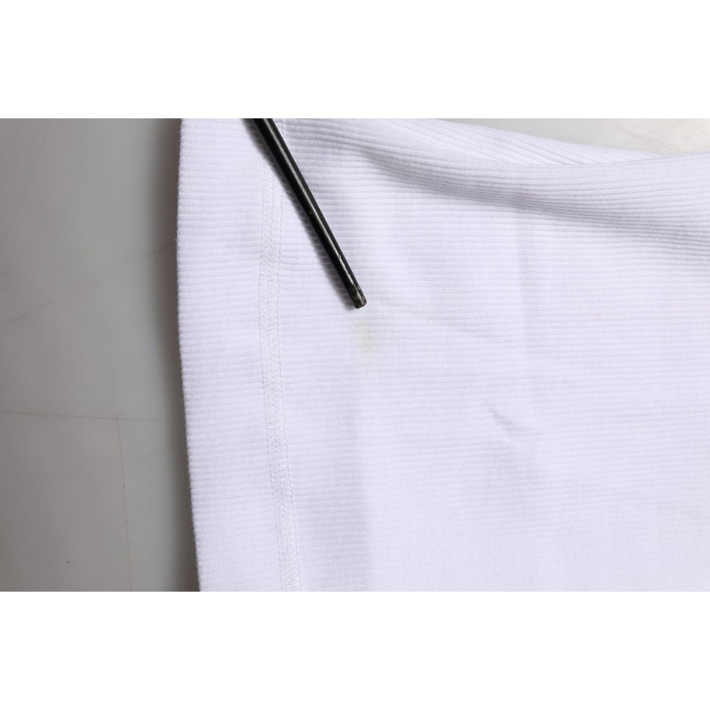 Close-up of Dolce & Gabbana White Sleeveless Round Neck Tank Top T-shirt showing minor stain detail.