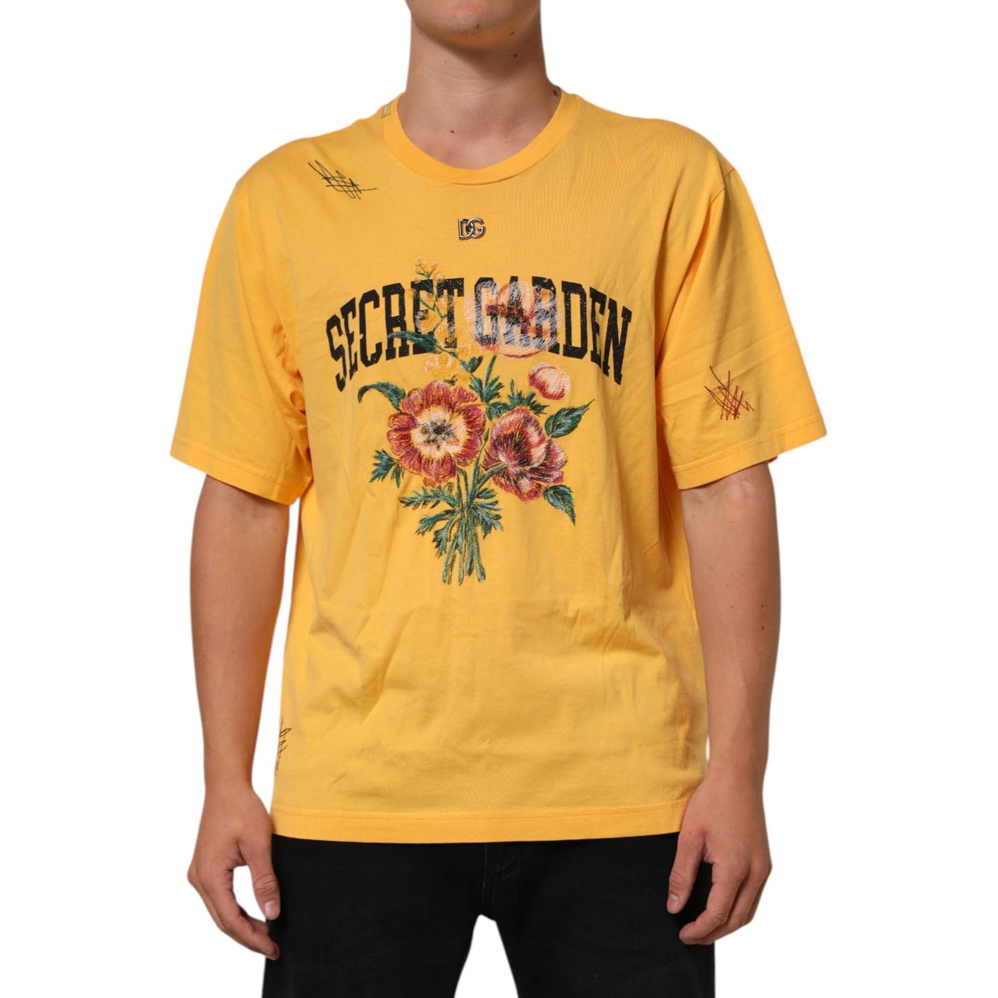Man wearing Dolce & Gabbana Yellow Secret Graden Floral Cotton Crew Neck T-shirt with floral print and crew neckline, front view.