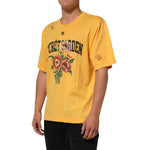 Dolce & Gabbana Yellow Secret Graden Floral Cotton Crew Neck T-shirt with floral print shown on model.