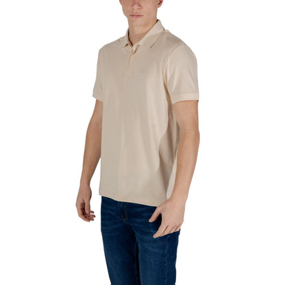 Man wearing EA7 Emporio Armani Beige Cotton Polo Shirt with short sleeves, ideal for smart casual outfits.