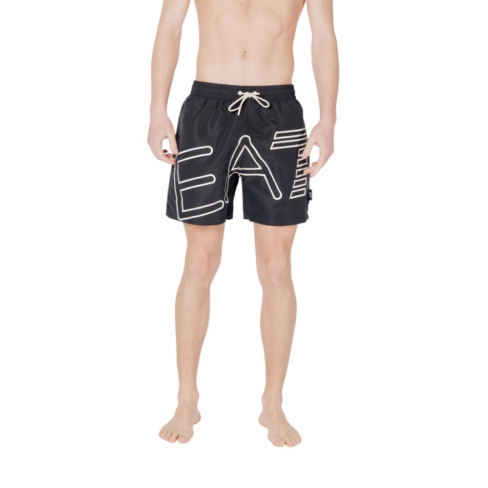Man wearing EA7 Emporio Armani Black Polyester Swim Shorts with logo and drawstring waistband, perfect for summer beachwear.