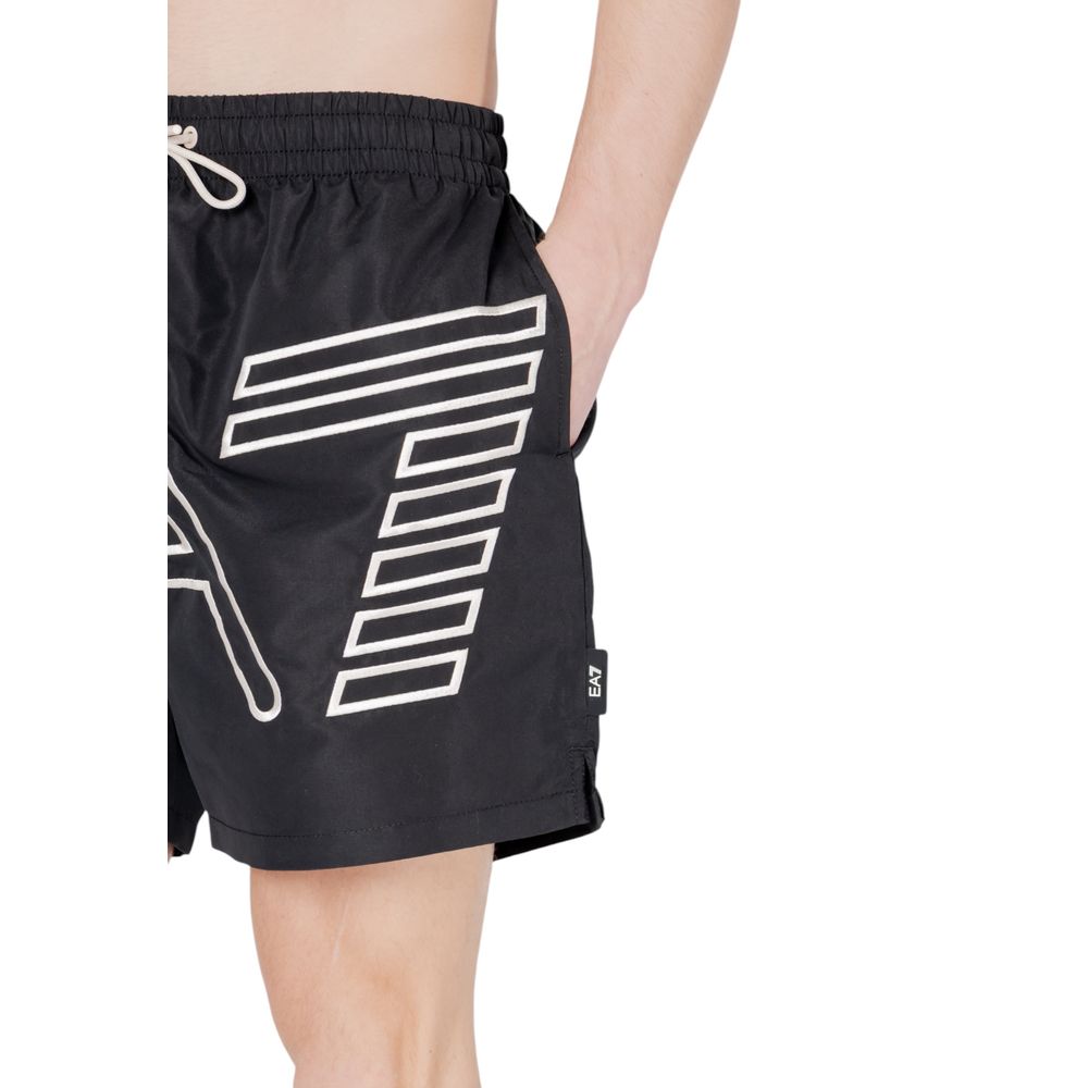 Close-up of EA7 Emporio Armani Black Polyester Swim Shorts with logo and adjustable drawstring, ideal for beach or pool.