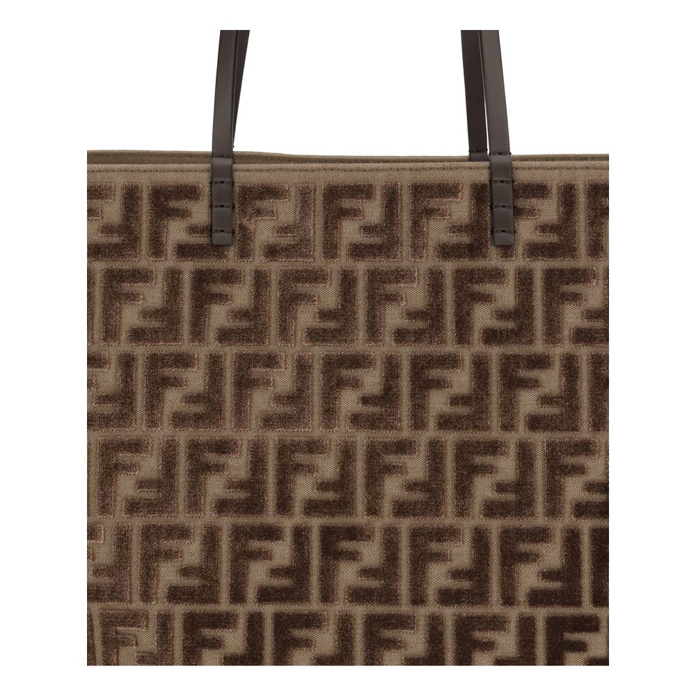 Close-up of Fendi Brown Fabric Shoulder Bag with FF chenille pattern and leather handles, showcasing luxurious design.