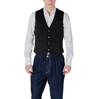 Man wearing Gianni Lupo Black Cotton Waistcoat with white shirt and jeans showing front pockets and three-button closure.
