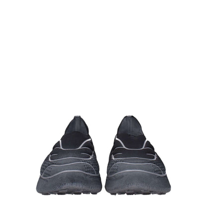 Front view of Givenchy Gray Fabric Athletic Sneakers with side logo and round toe design.