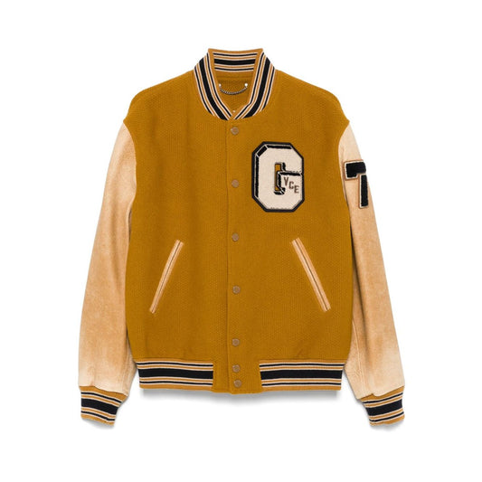 Golden Goose Coats mustard yellow bomber with leather sleeves, varsity-style patches, and ribbed trims.