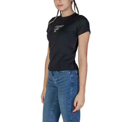 Woman wearing Guess Active Black Cotton T-Shirt with Guess logo and blue jeans, showcasing short-sleeve casual style.