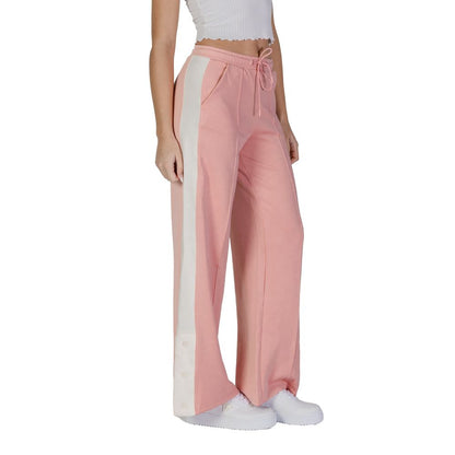 Woman wearing Guess Active Multicolor Polyester Joggers (Workout Pants) with side pockets and drawstring closure in pink and white.