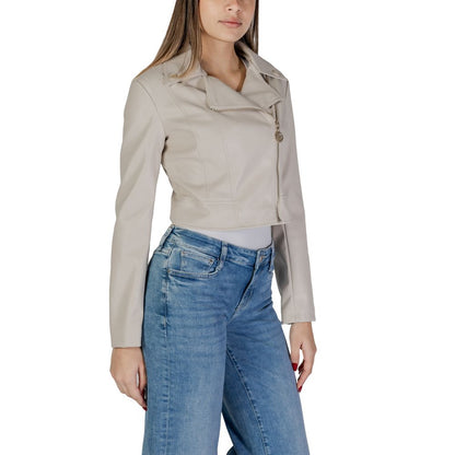 Woman wearing Guess Beige Polyethylene Biker Jacket with jeans, featuring wide collar and asymmetric zip.