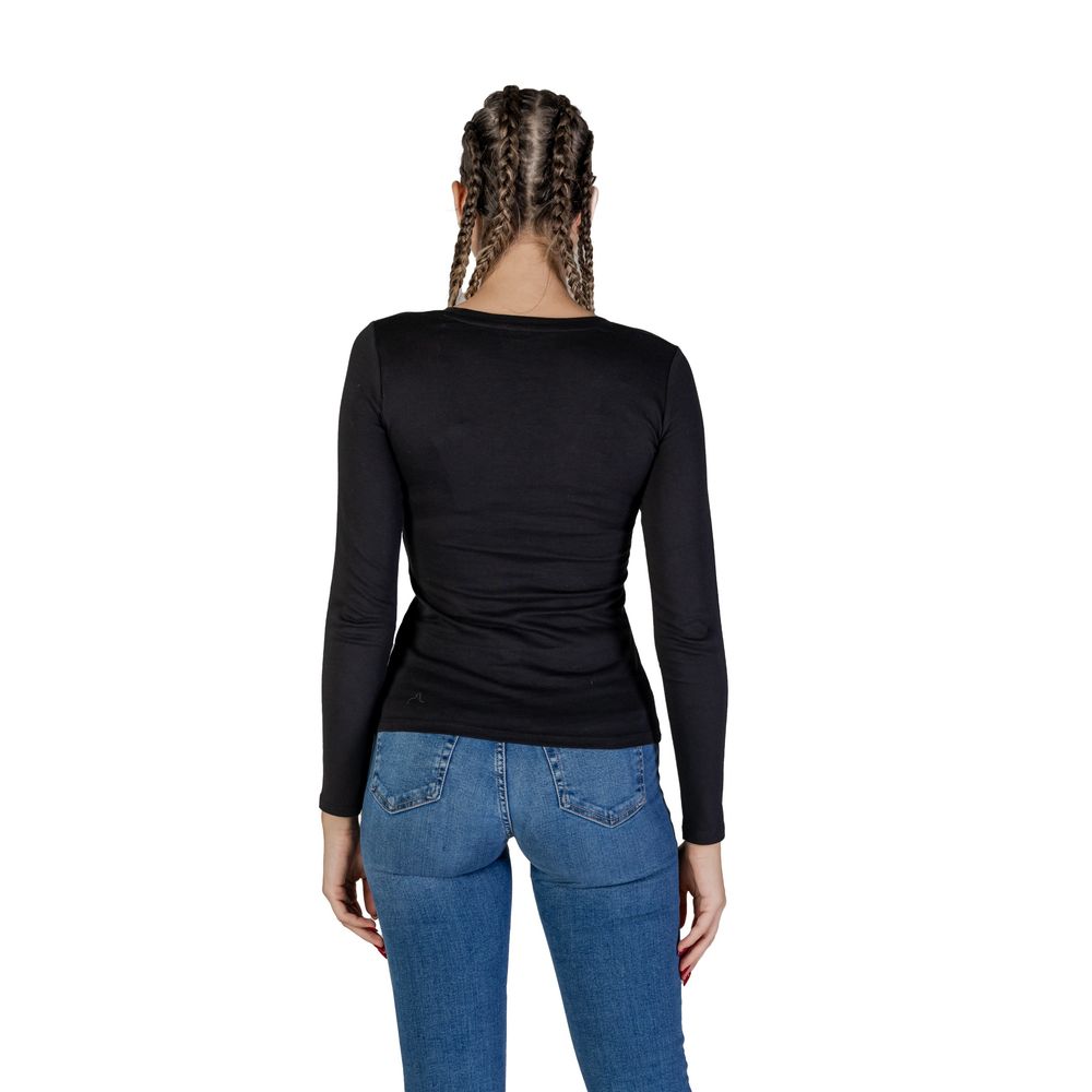 Back view of woman wearing Guess Black Cotton Long Sleeve T-Shirt with jeans, showing the casual and sophisticated design.