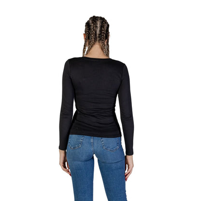 Back view of woman wearing Guess Black Cotton Long Sleeve T-Shirt with jeans, showing the casual and sophisticated design.