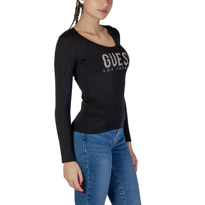Woman wearing Guess Black Cotton Long Sleeve T-Shirt with logo and python-effect detail, paired with jeans.