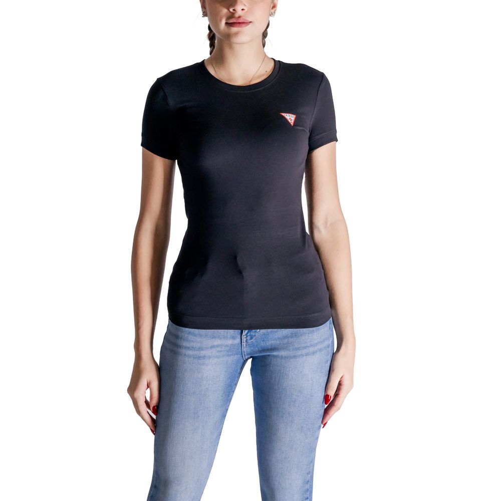 Woman wearing a Guess Black Cotton T-Shirt with mini triangle logo, short sleeves, crafted from cotton and elastane for comfort and stretch.