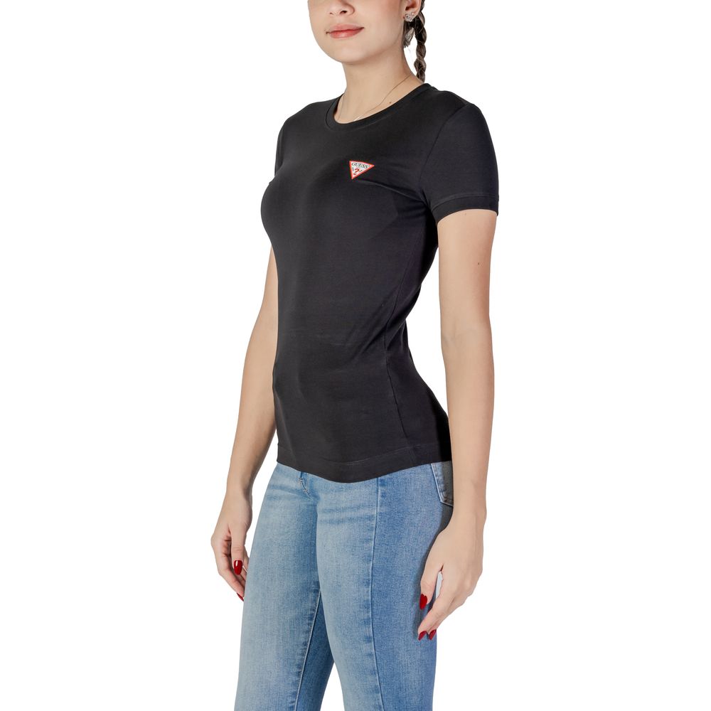 Woman wearing Guess Black Cotton T-Shirt with mini triangle logo, showcasing classic style and comfortable fit.