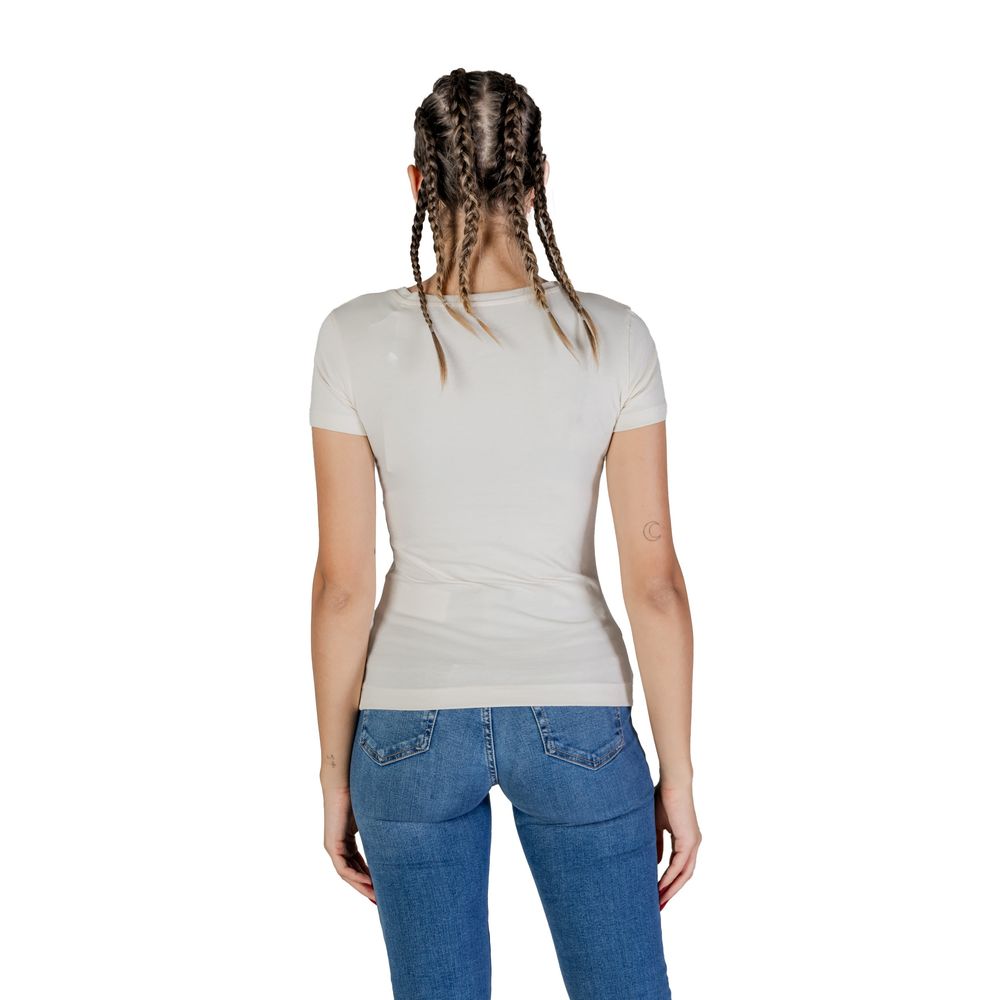 Back view of woman wearing Guess Cream Cotton T-Shirt, showcasing short sleeves and slim fit perfect for casual style.