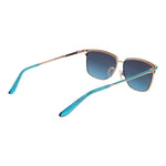 Guess Gold Women Sunglass with gold metal full-rim frame, green gradient lenses, and butterfly style, includes branded case.
