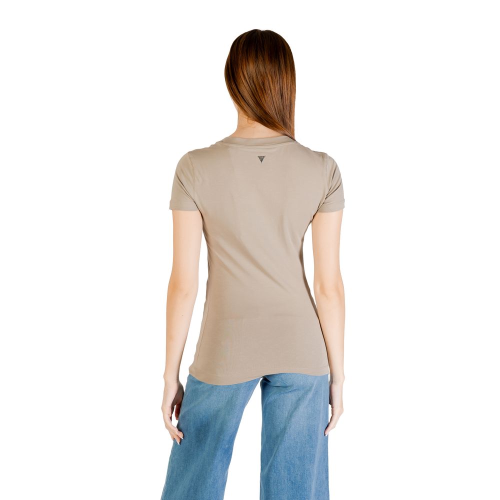 Back view of woman wearing Guess Green Cotton T-Shirt paired with jeans, showcasing stylish bead-adorned triangle design. Perfect for casual wear.