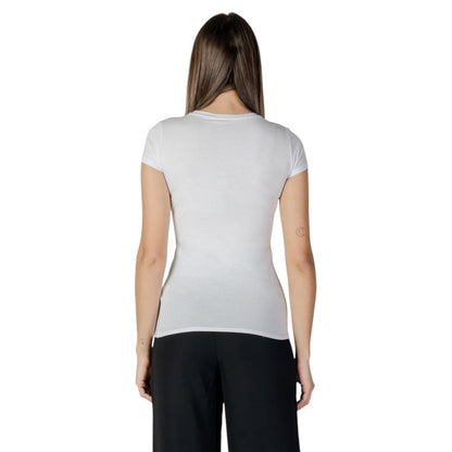 Back view of a woman wearing a Guess White Cotton T-Shirt, showcasing a sleek and comfortable fit with short sleeves.
