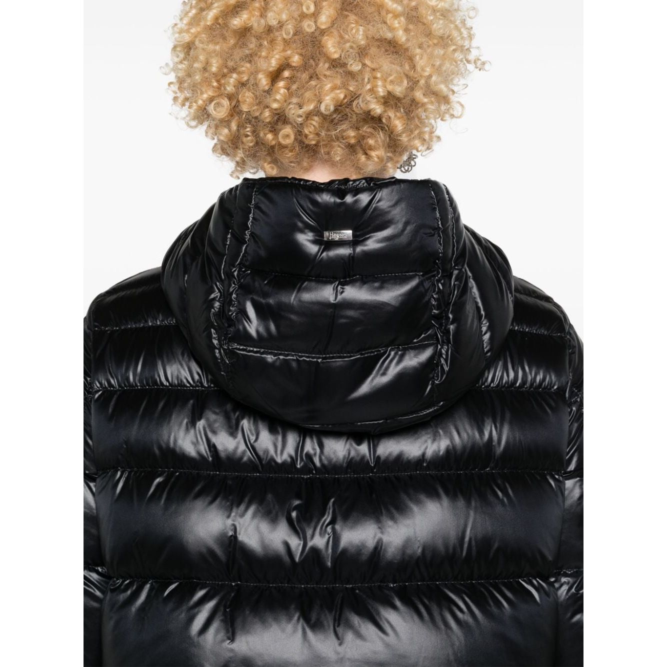 Back view of black padded Herno Coats Black with hood and curly hair model.