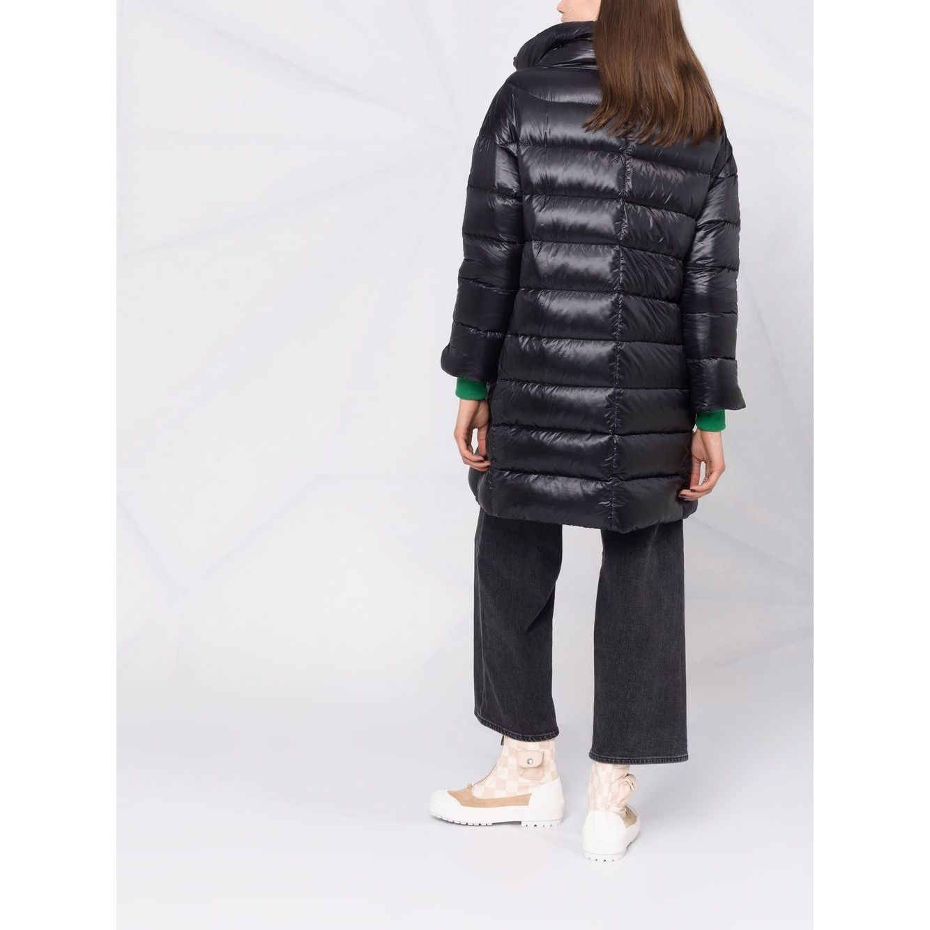Woman wearing Herno Coats Black with feather down padding, knee-length design, and stand-up collar, showcasing back view.