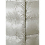 Close-up of Herno Coats Light Grey, featuring the padded texture of the Dora long down jacket in a light grey color.