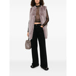 Model wearing grey faux fur sleeveless vest over sheer top with black pants, showcasing Herno Jackets Pink, round neck, straight hem design.