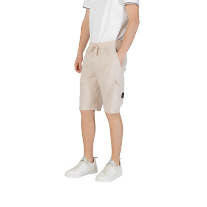 Model wearing Hugo Boss Beige Polyester Bermuda Shorts with side pockets and elastic waistband, showcasing casual style and comfort.