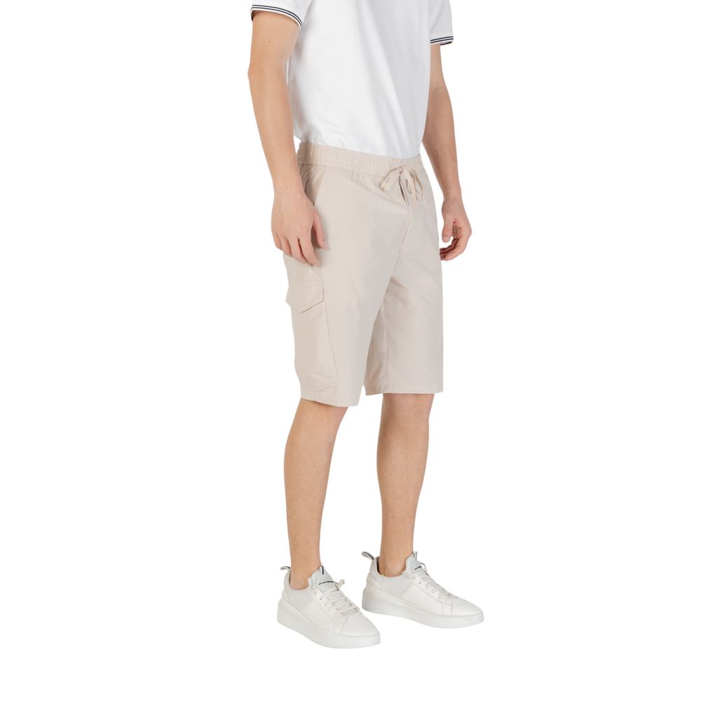 Man wearing Hugo Boss Beige Polyester Bermuda Shorts with side pockets and elastic waistband.