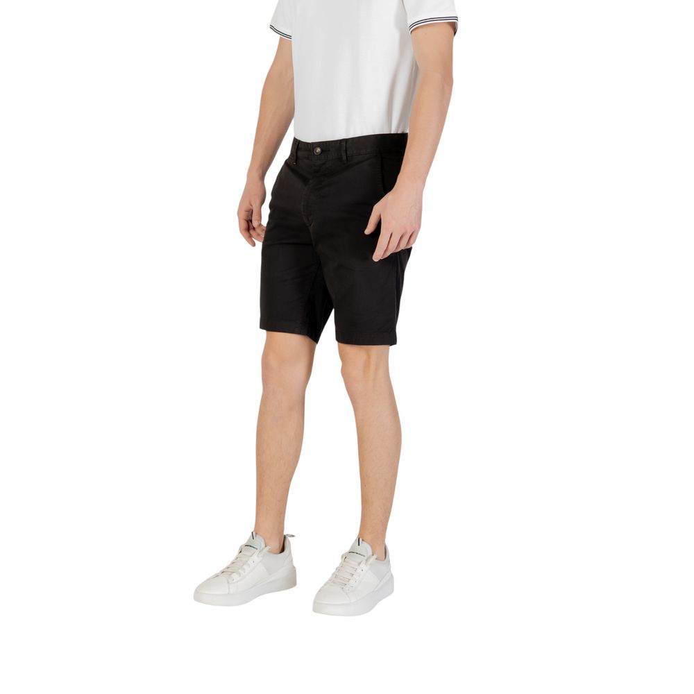 Model wearing Hugo Boss Black Cotton Bermuda Shorts with white shirt and sneakers
