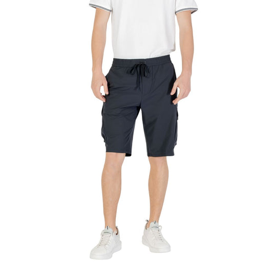Model wearing Hugo Boss Blue Polyester Bermuda Shorts with drawstring waist and side pockets, showcasing casual style.