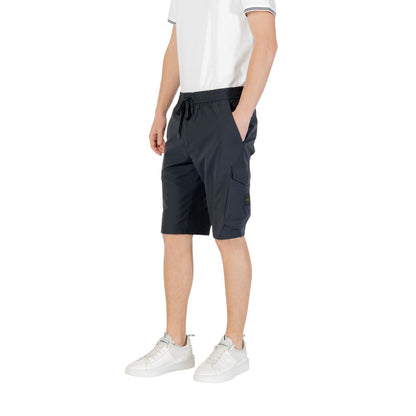 Model wearing Hugo Boss Blue Polyester Bermuda Shorts with side pockets and elastic waistband, showcasing casual summer style
