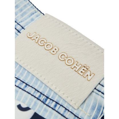 Jacob Cohen Blue Cotton Skinny Jeans label tag in white with logo embroidery on light blue striped denim background.