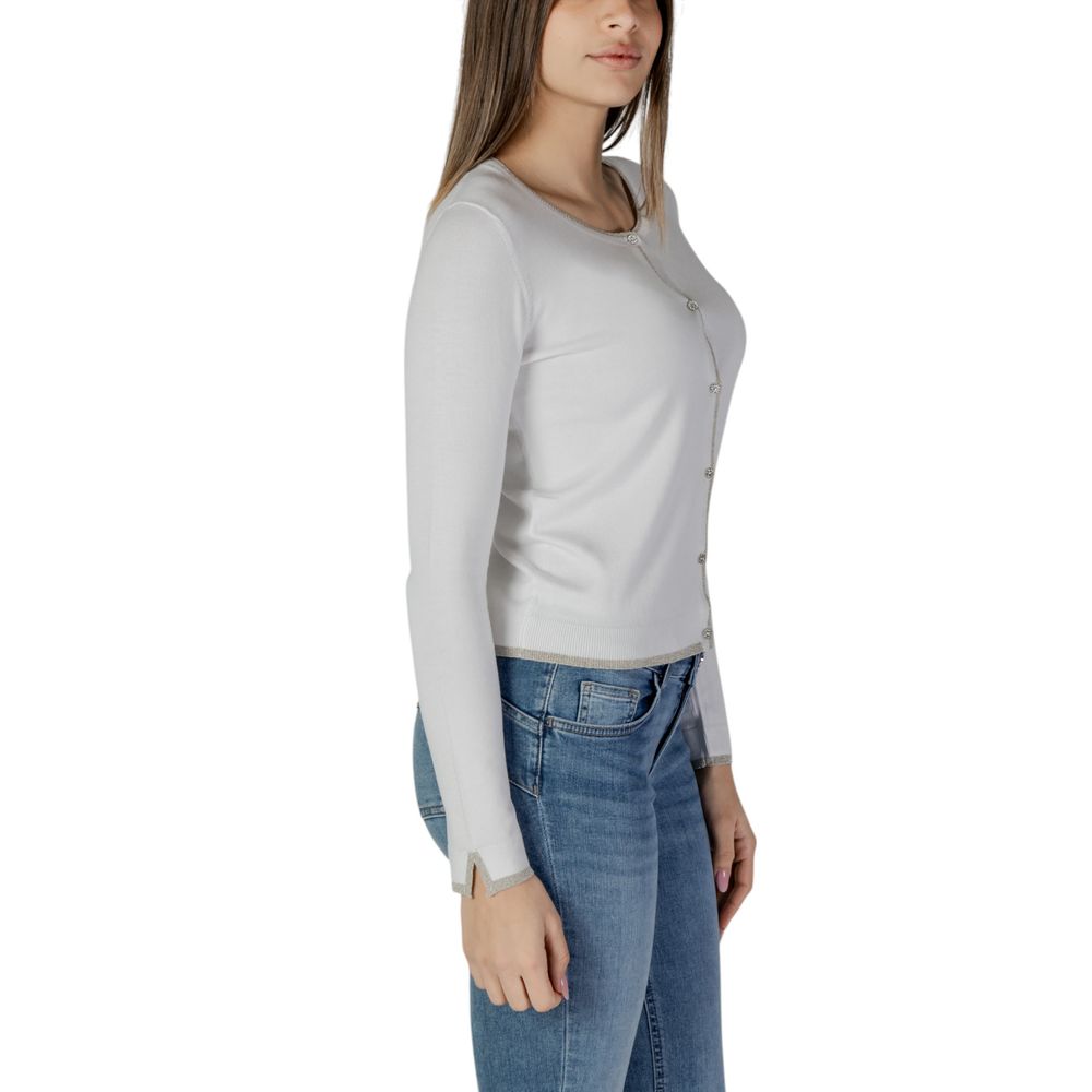 Woman wearing Liu Jo White Viscose Cardigan with long sleeves, showcasing front button closure and sparkling trim details.
