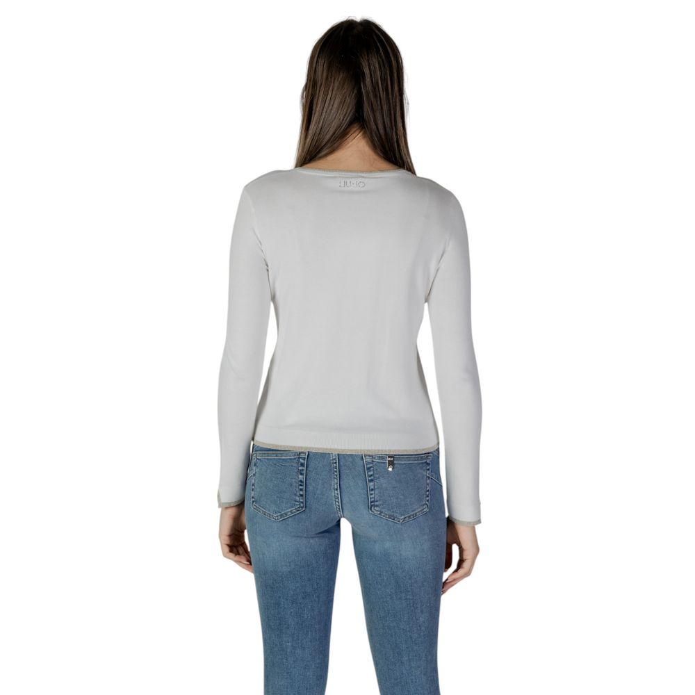 Back view of a woman wearing a Liu Jo White Viscose Cardigan with jeans, showcasing the long sleeves and fit.