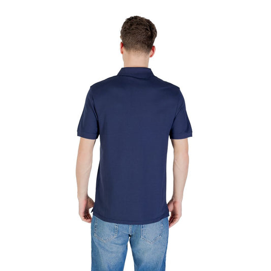 Back view of Lyle & Scott Blue Cotton Polo Shirt on a man wearing jeans.